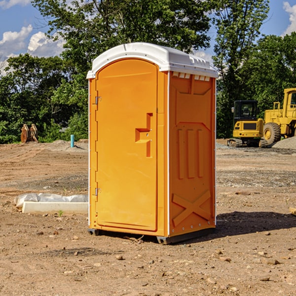 how often are the portable restrooms cleaned and serviced during a rental period in Grass Lake